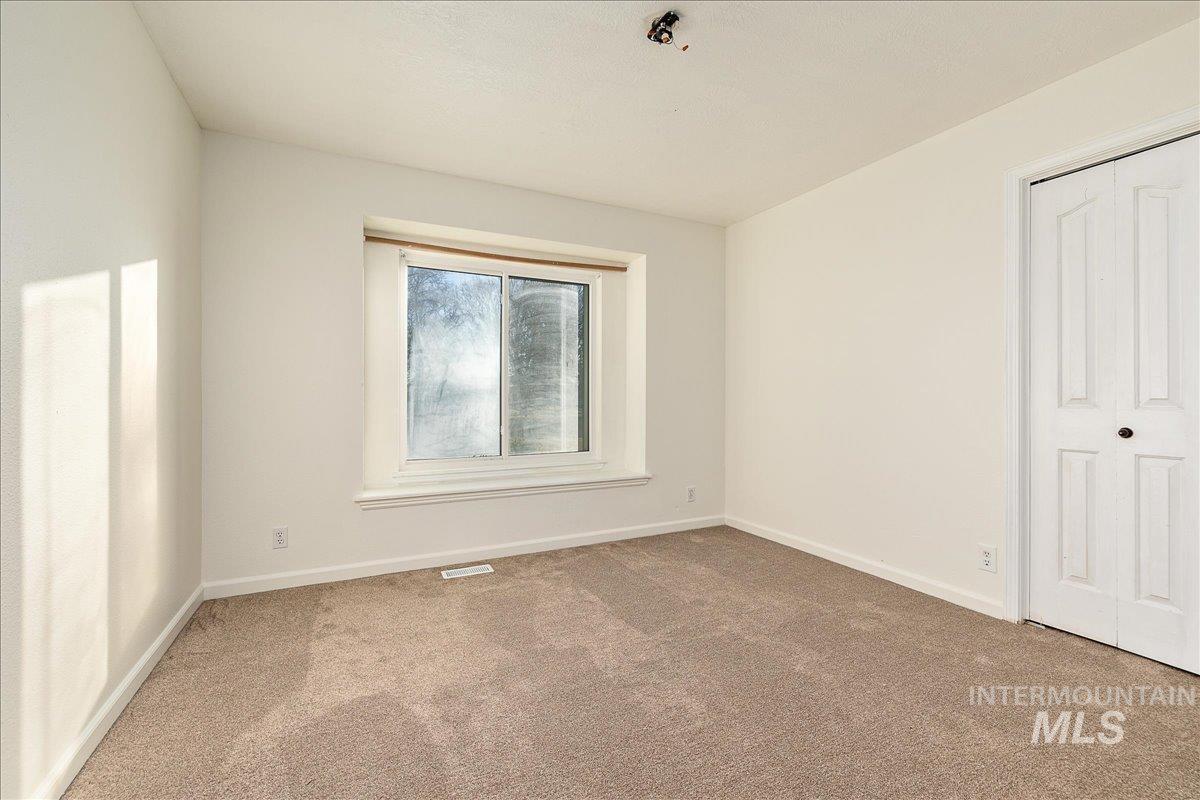 411 Hawthorne Street Nampa, ID 83686 - Photo 30 of 48 Unfurnished bedroom featuring carpet flooring and a closet