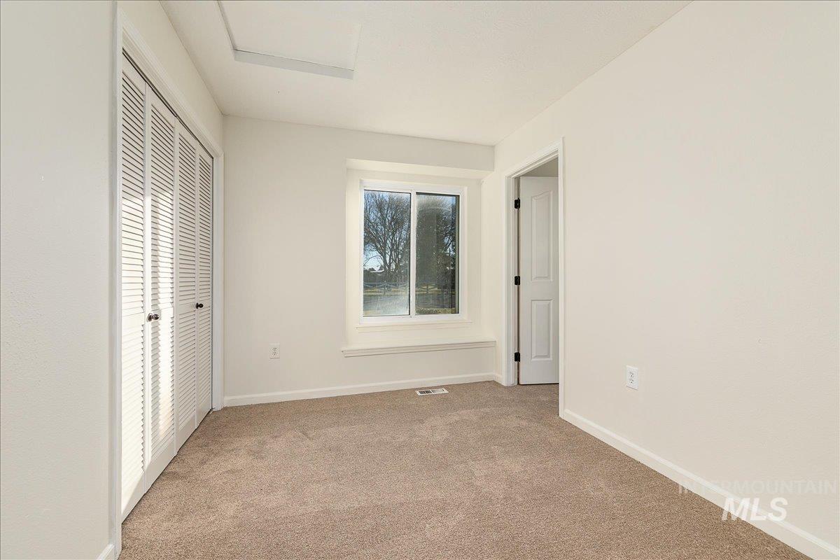 411 Hawthorne Street Nampa, ID 83686 - Photo 31 of 48 Unfurnished bedroom featuring light carpet and a closet