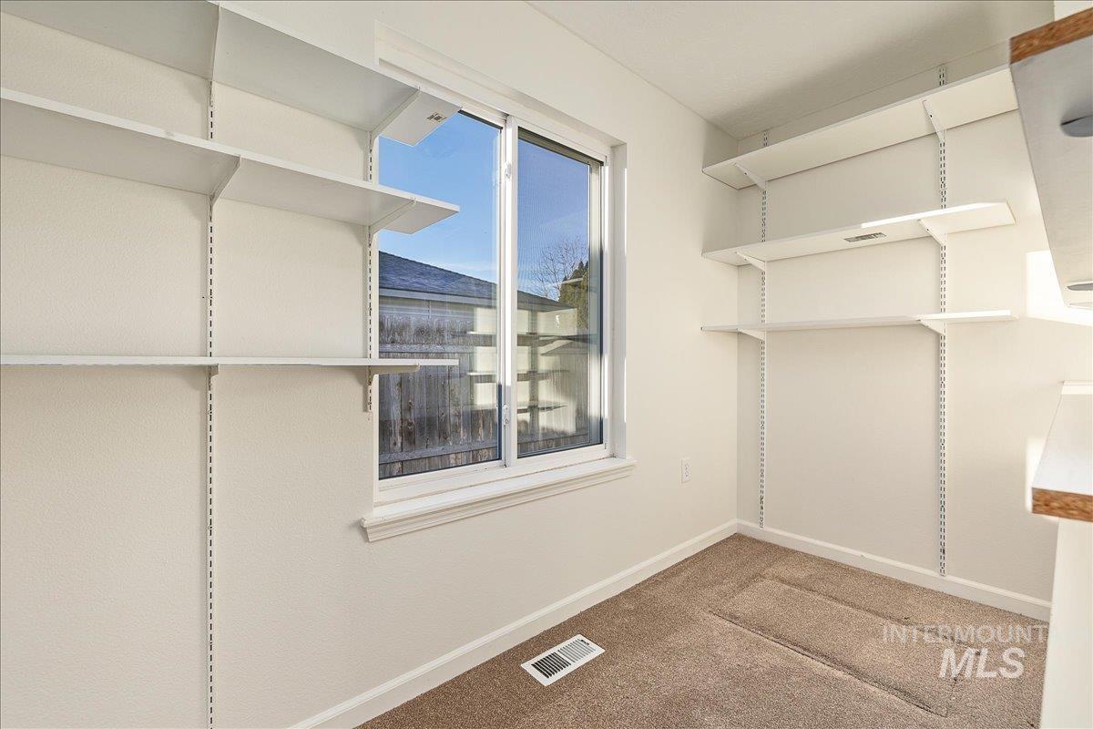 411 Hawthorne Street Nampa, ID 83686 - Photo 32 of 48 Walk in closet with carpet floors