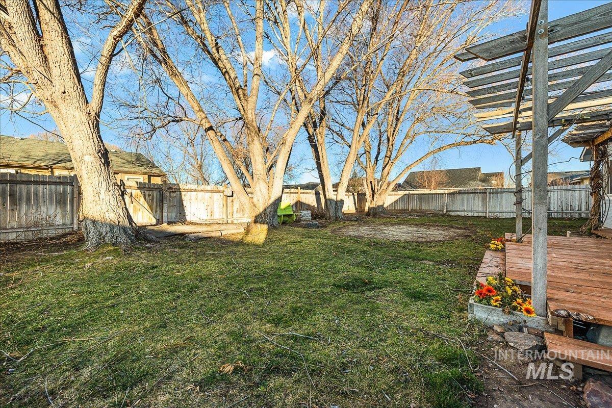 411 Hawthorne Street Nampa, ID 83686 - Photo 41 of 48 Fenced backyard with a deck