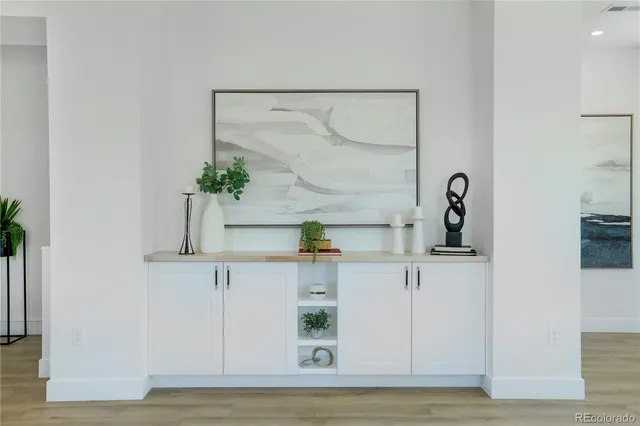 a view of cabinets and wooden floor