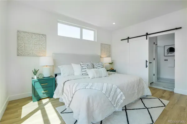 a bedroom with a bed and a shower