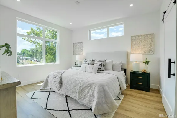 a bed room with a bed and a window