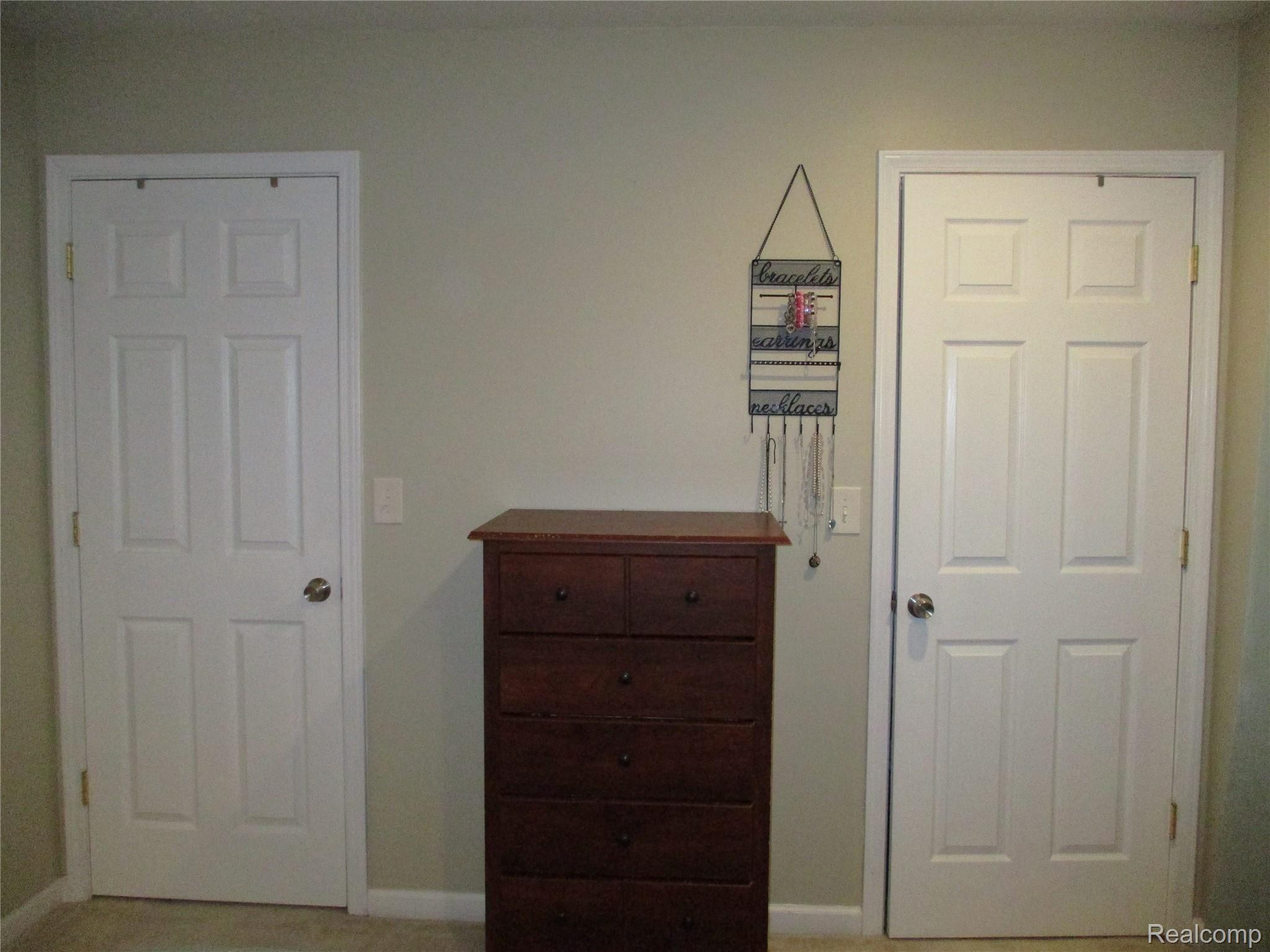 19215 Inkster Road Livonia, MI 48152 - Photo 27 of 43 MASTER BEDROOM WITH WALK THROUGH HIS/HER CLOSETS