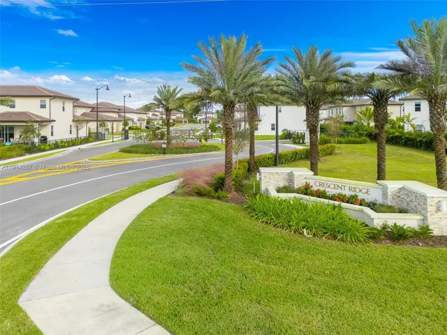 a view of a swimming pool with a lawn chairs next to yard