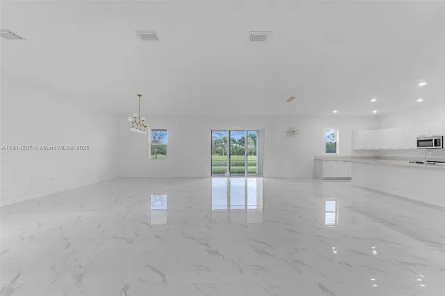 a view of a kitchen with a sink and cabinets