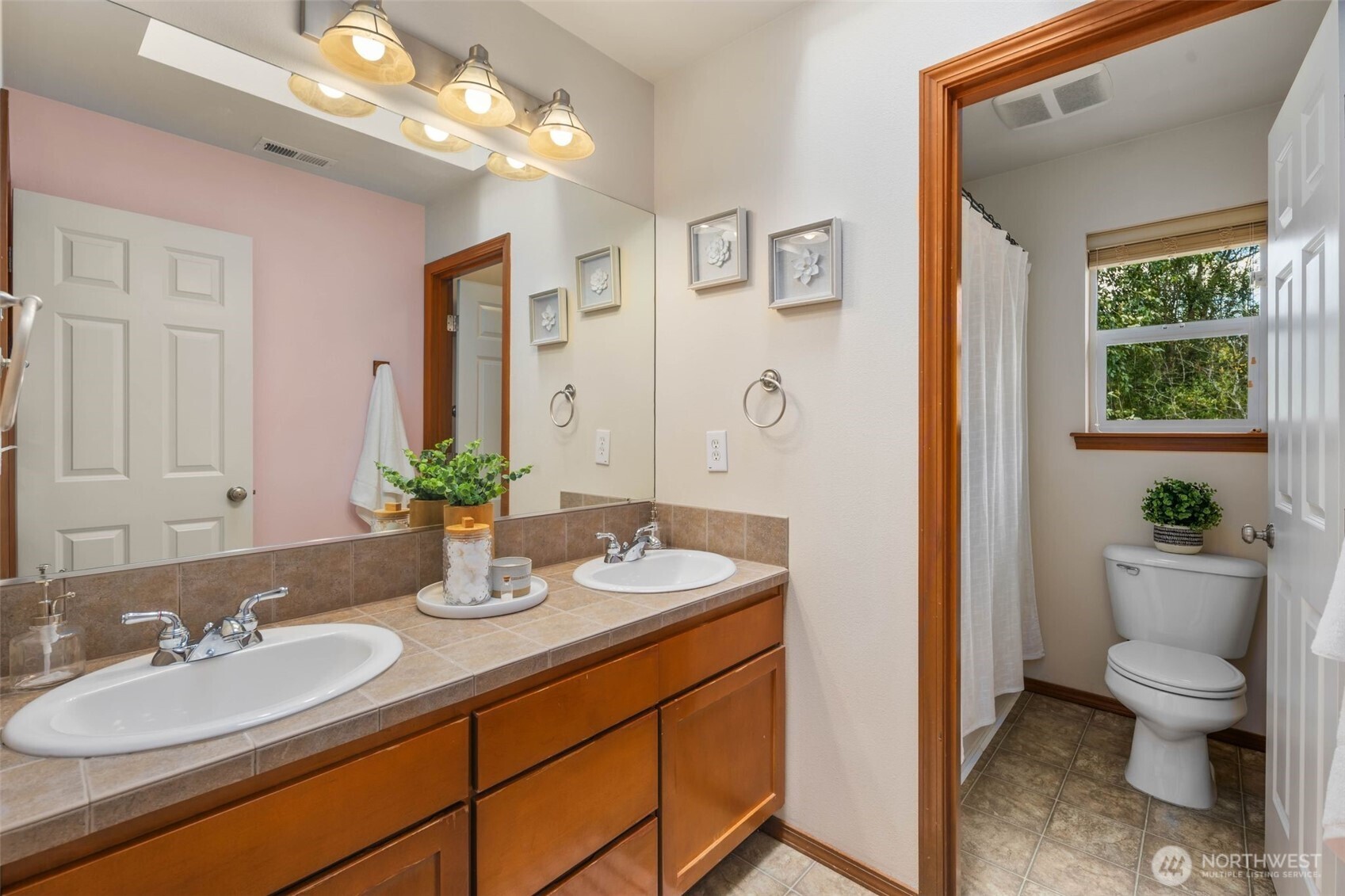 18705 3rd Avenue West Bothell, WA 98012 - Photo 20 of 35 a bathroom with a granite countertop sink a toilet and a mirror