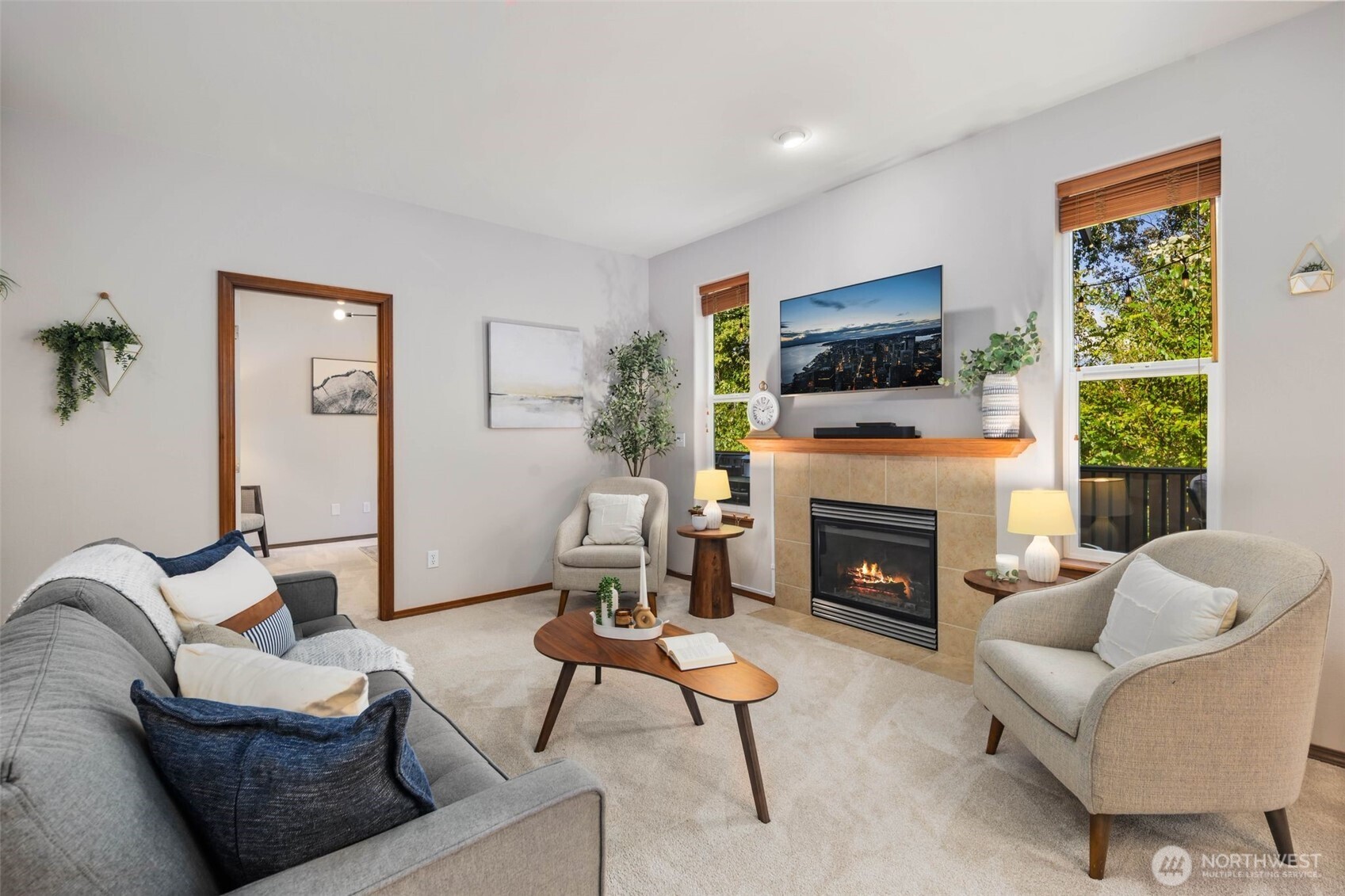 18705 3rd Avenue West Bothell, WA 98012 - Photo 6 of 35 a living room with furniture a flat screen tv and a fireplace