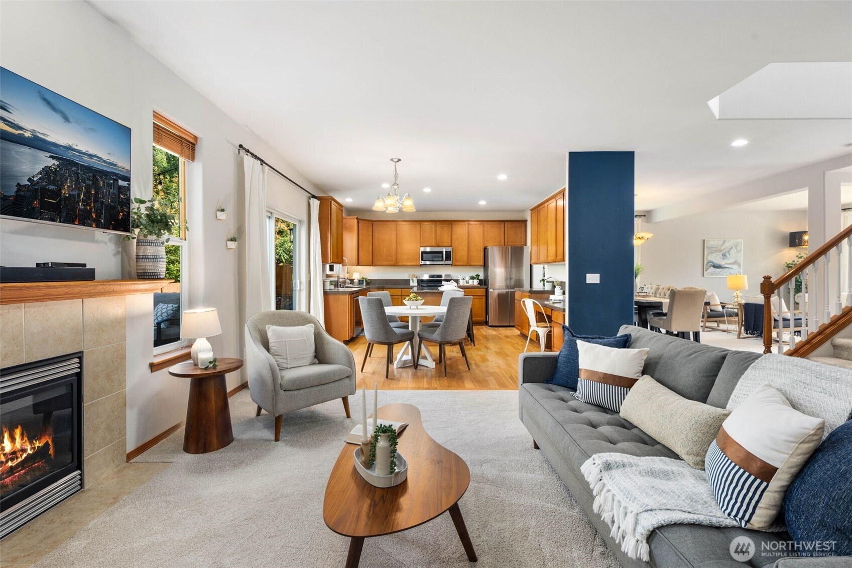 18705 3rd Avenue West Bothell, WA 98012 - Photo 8 of 35 a living room with furniture kitchen view and a fireplace