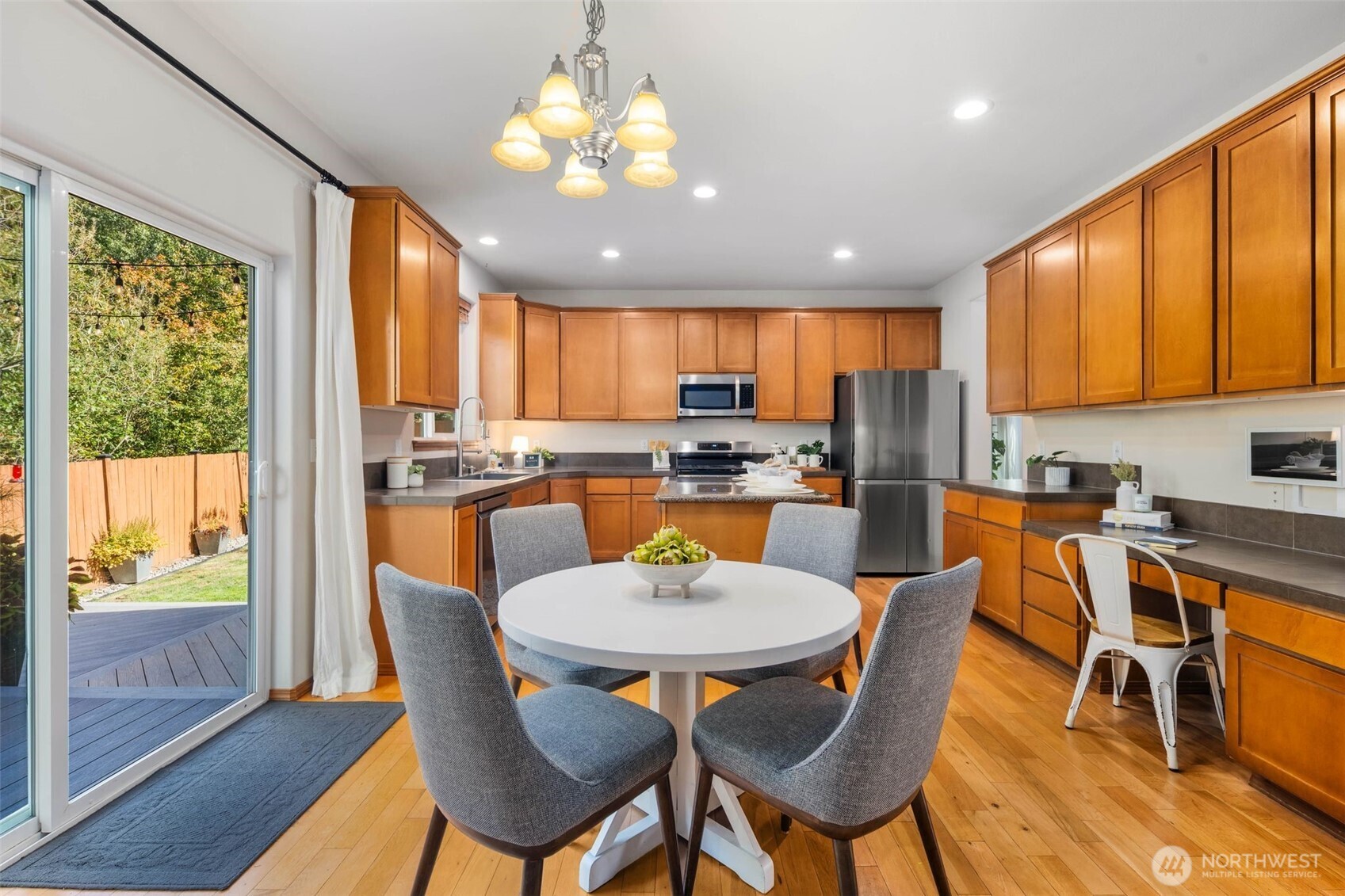 18705 3rd Avenue West Bothell, WA 98012 - Photo 9 of 35 a view of a dining room with furniture window and wooden floor