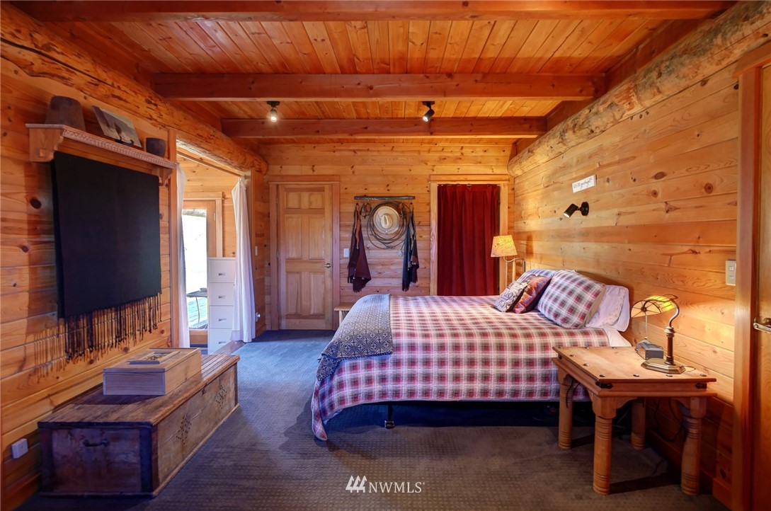 6 Beaver Pond Road Twisp, WA 98856 - Photo 14 of 40 a bedroom with furniture and a flat screen tv