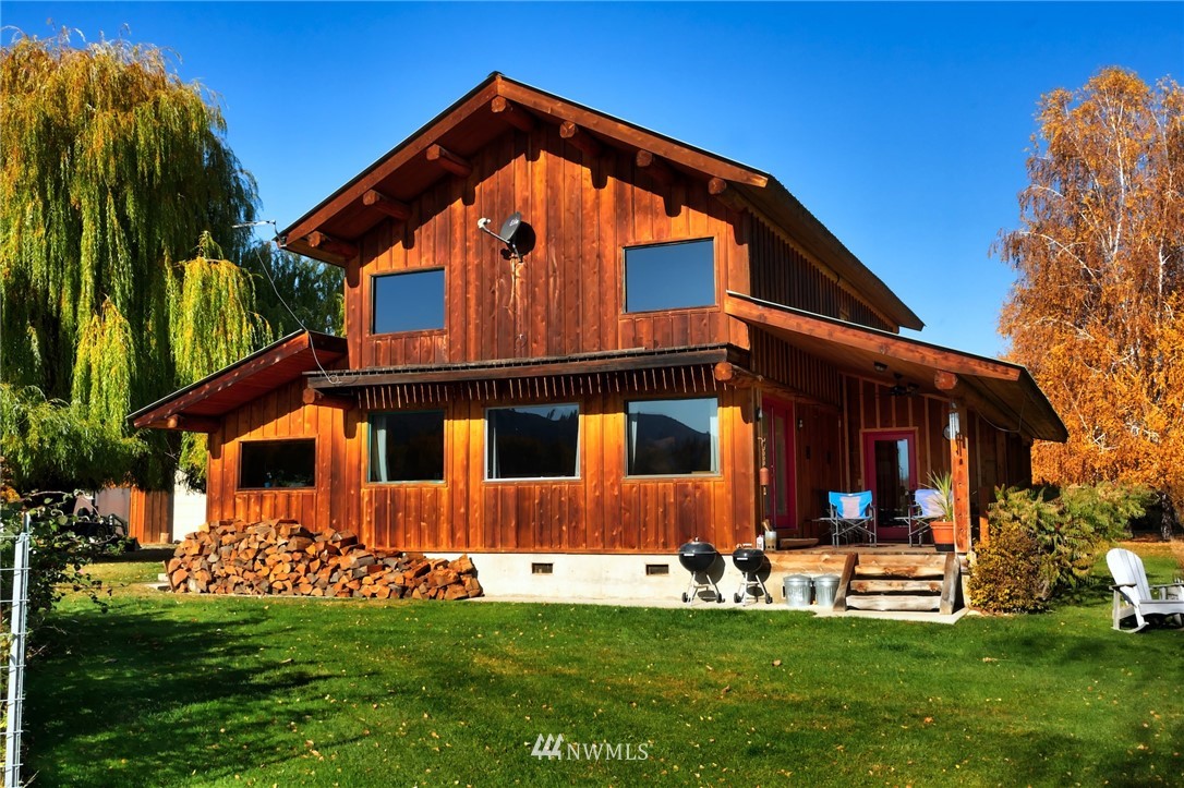 6 Beaver Pond Road Twisp, WA 98856 - Photo 19 of 40 a front view of a house with a yard