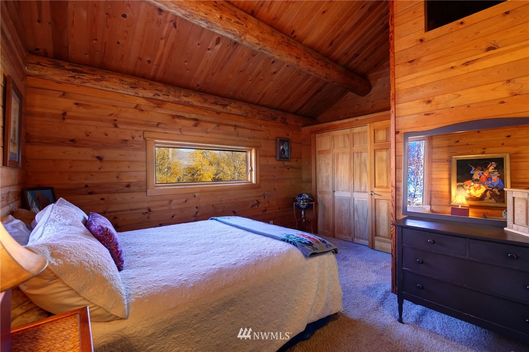 6 Beaver Pond Road Twisp, WA 98856 - Photo 34 of 40 a bedroom with a bed and a dresser