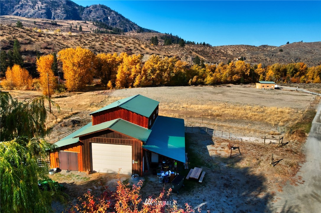 6 Beaver Pond Road Twisp, WA 98856 - Photo 6 of 40 a view of swimming pool with a yard and mountain view in back