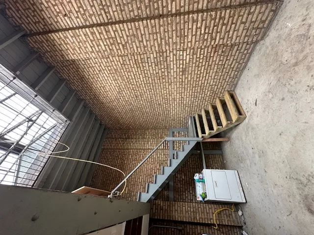 a room with water heater and a cabinet