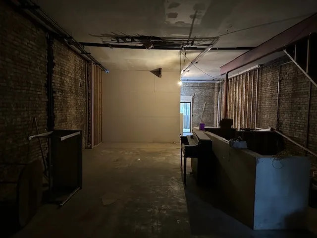 a bathroom with a shower and a mirror