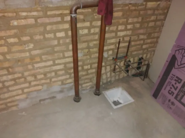 a view of a storage & utility room with two washing machine