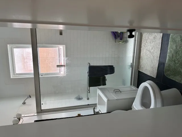 a bathroom with a toilet sink and tub