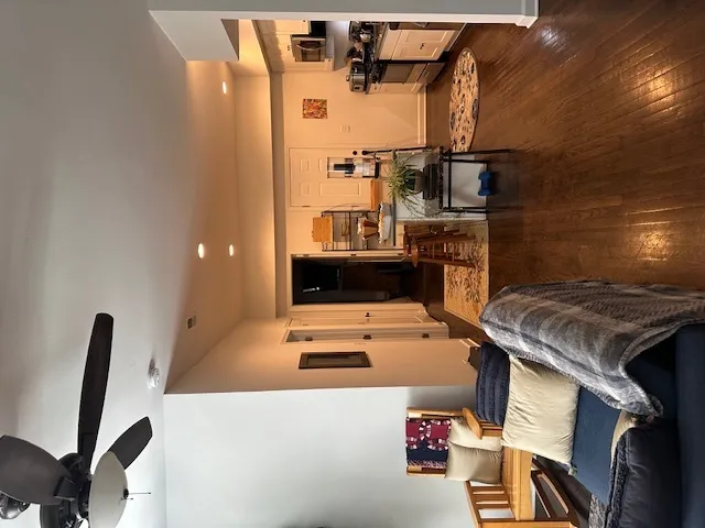 a kitchen with stainless steel appliances a refrigerator sink and microwave