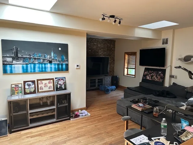 a kitchen with cabinets and stainless steel appliances