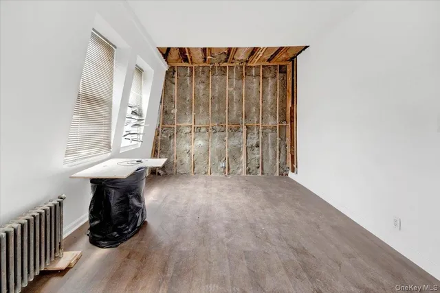 a view of entryway with wooden floor