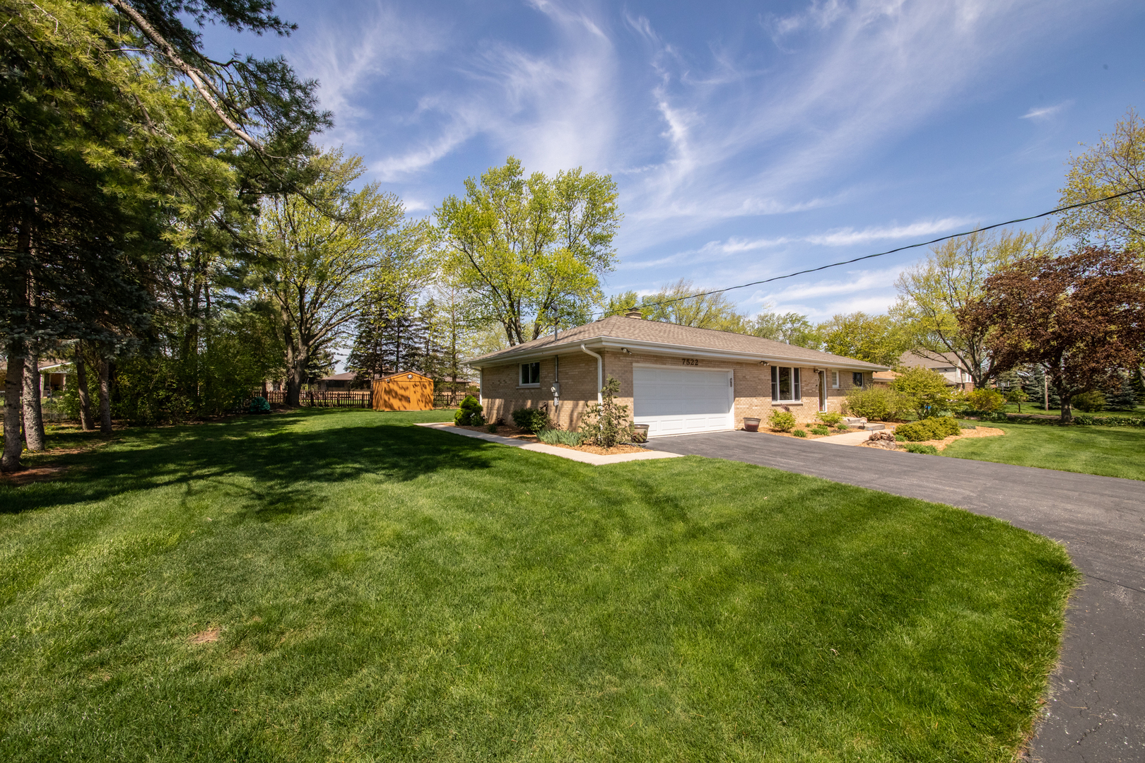 7522 Brookbank Road Willowbrook, IL 60527 - Photo 18 of 18 a front view of a house with a big yard