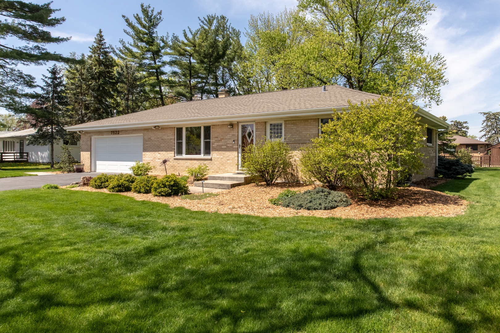 7522 Brookbank Road Willowbrook, IL 60527 - Photo 2 of 18 a front view of house with yard and green space