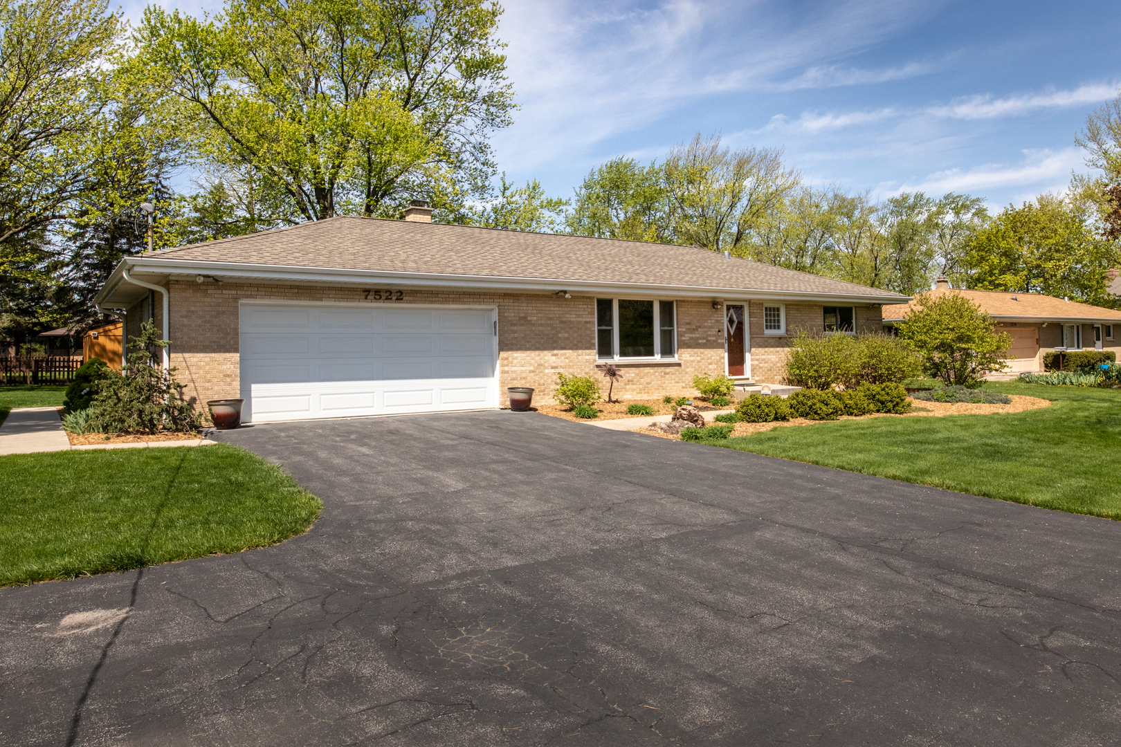 7522 Brookbank Road Willowbrook, IL 60527 - Photo 3 of 18 a front view of house with yard and green space