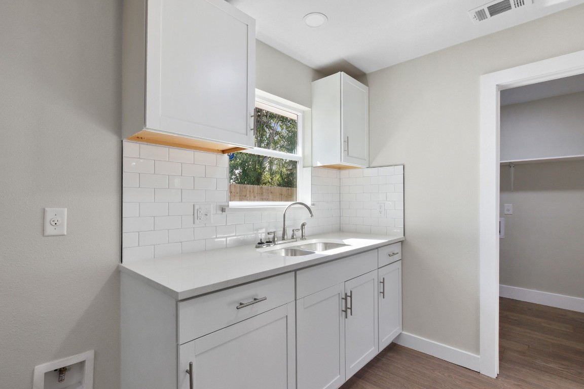 713 Burkett Street Taylor, TX 76574 - Photo 11 of 25 a bathroom with a sink and a mirror
