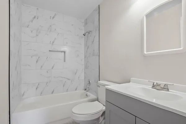 a bathroom with a sink toilet and bathtub