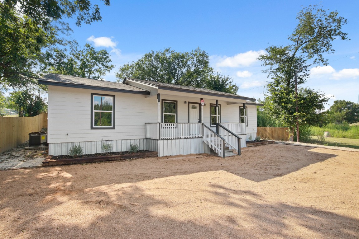 713 Burkett Street Taylor, TX 76574 - Photo 2 of 25 a view of a house with backyard and sitting area