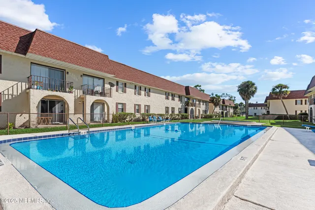 a view of swimming pool with outdoor seating
