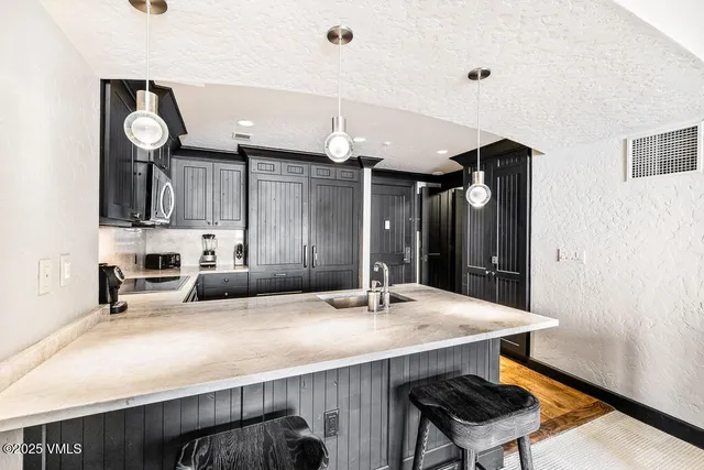 a bed room with a bed and a chair