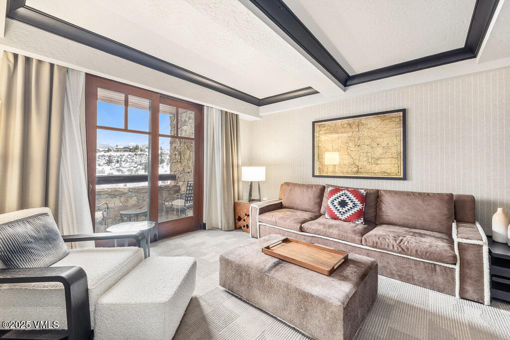 130 Daybreak Ridge Road, Unit HS613 Avon, CO 81620 - Photo 7 of 22 a living room with furniture and a large window