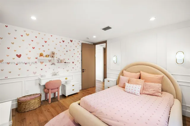 a bedroom with a large bed and a couch