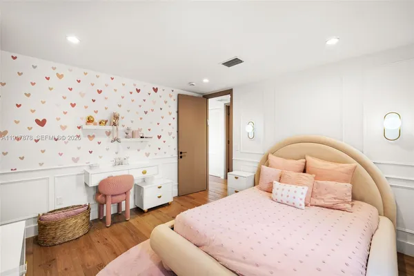 a bathroom with a toilet shower vanity and a sink