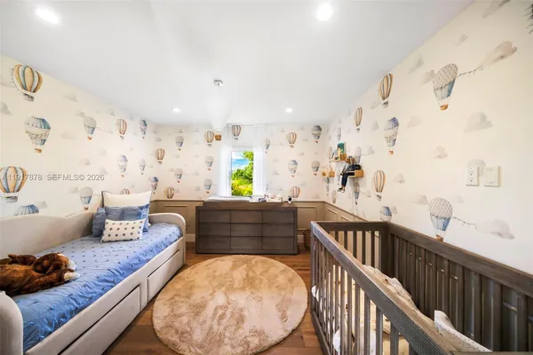 a bedroom with a large bed and a couch