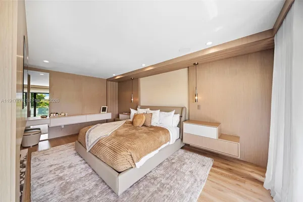 a view of a patio with a table and chairs and potted plants