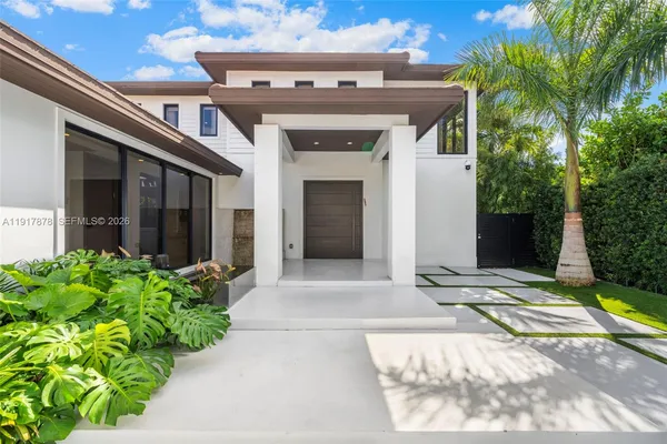 a view of a hallway with living room