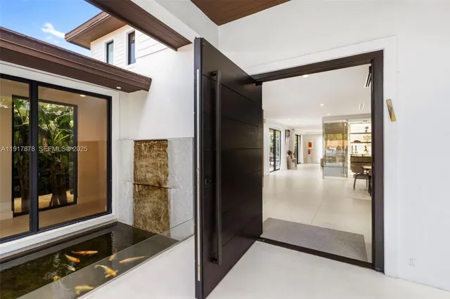 a view of entryway and hall with dining room