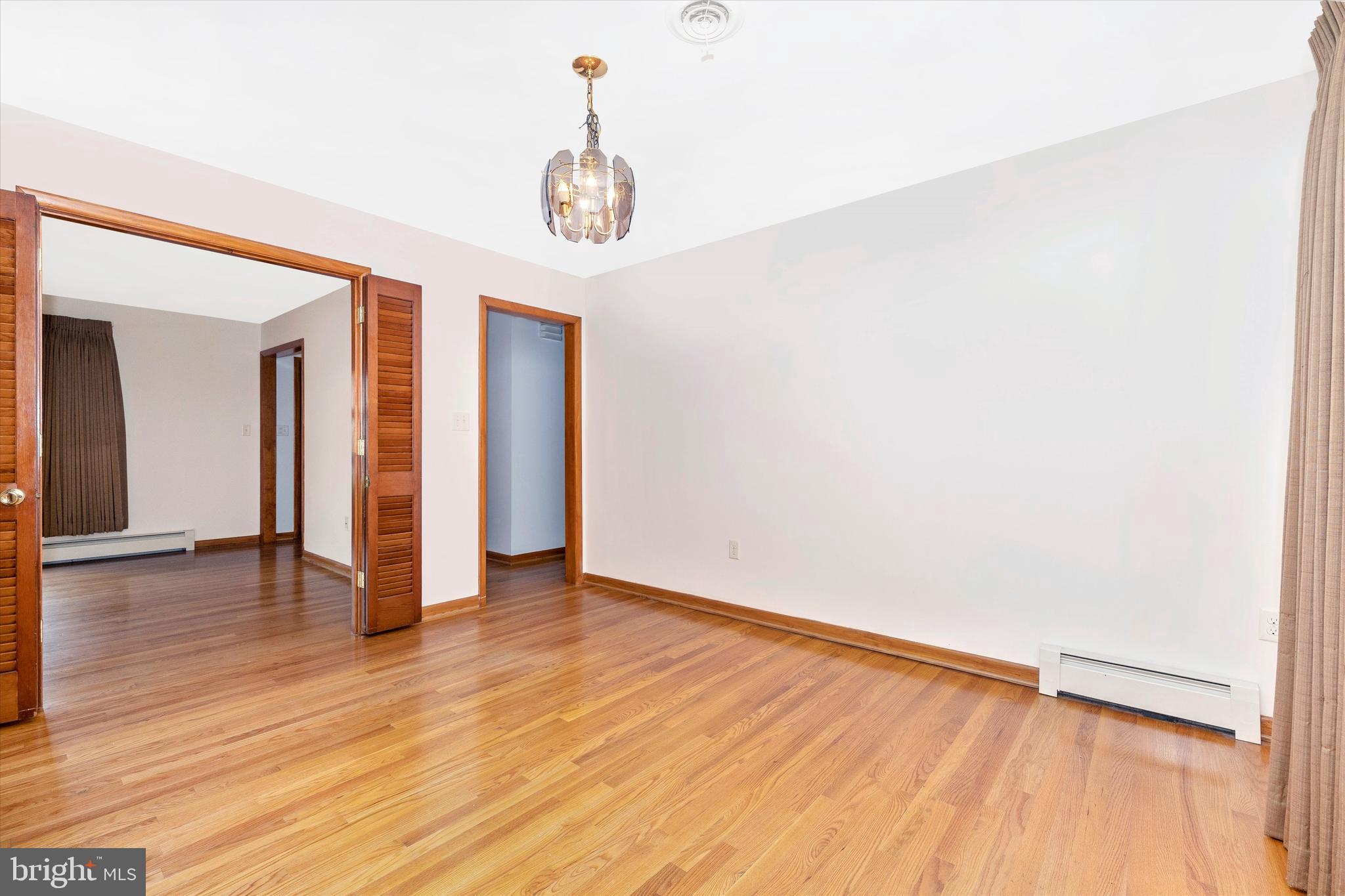 8911 Yellow Springs Road Frederick, MD 21702 - Photo 14 of 37 a view of an empty room with wooden floor