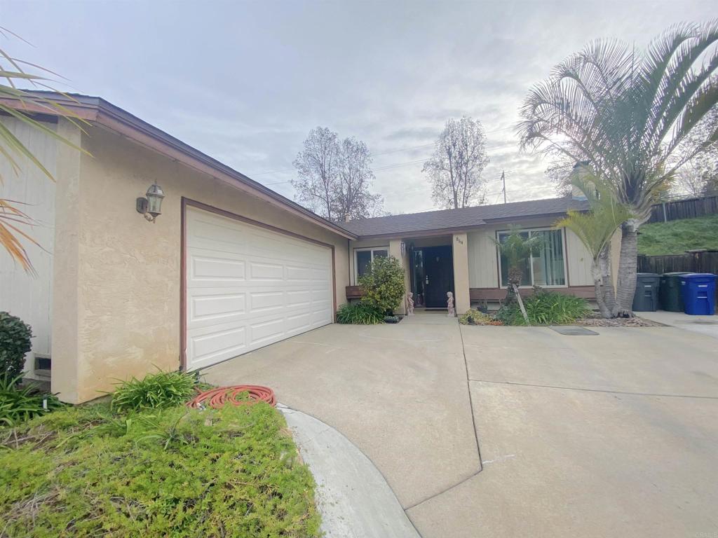 864 Willow Tree Lane Fallbrook, CA 92028 - Photo 9 of 9 a view of a house with a yard and potted plants