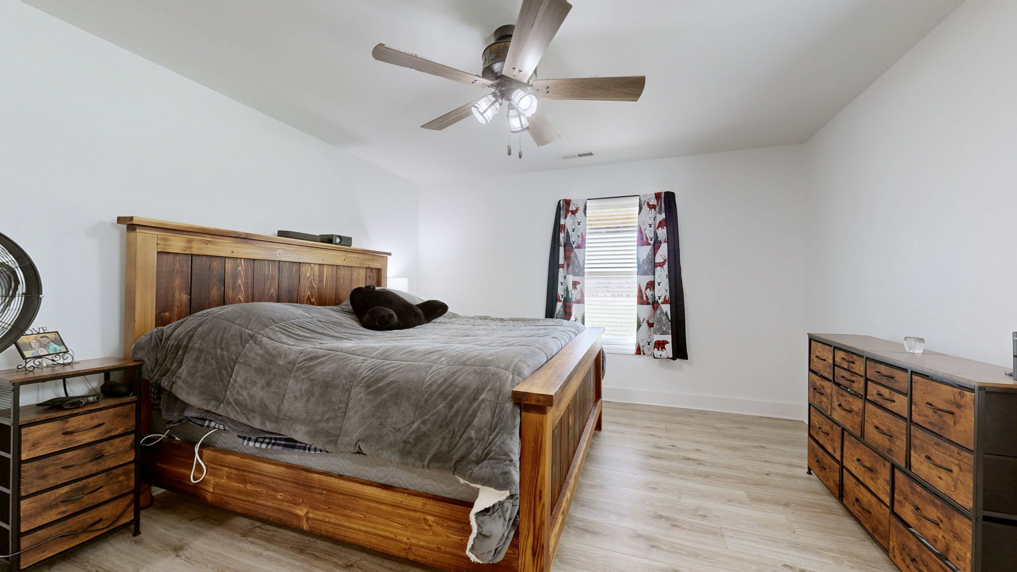 2586 Brown Shop Road Petersburg, TN 37144 - Photo 29 of 57 a bedroom with a bed and a chandelier