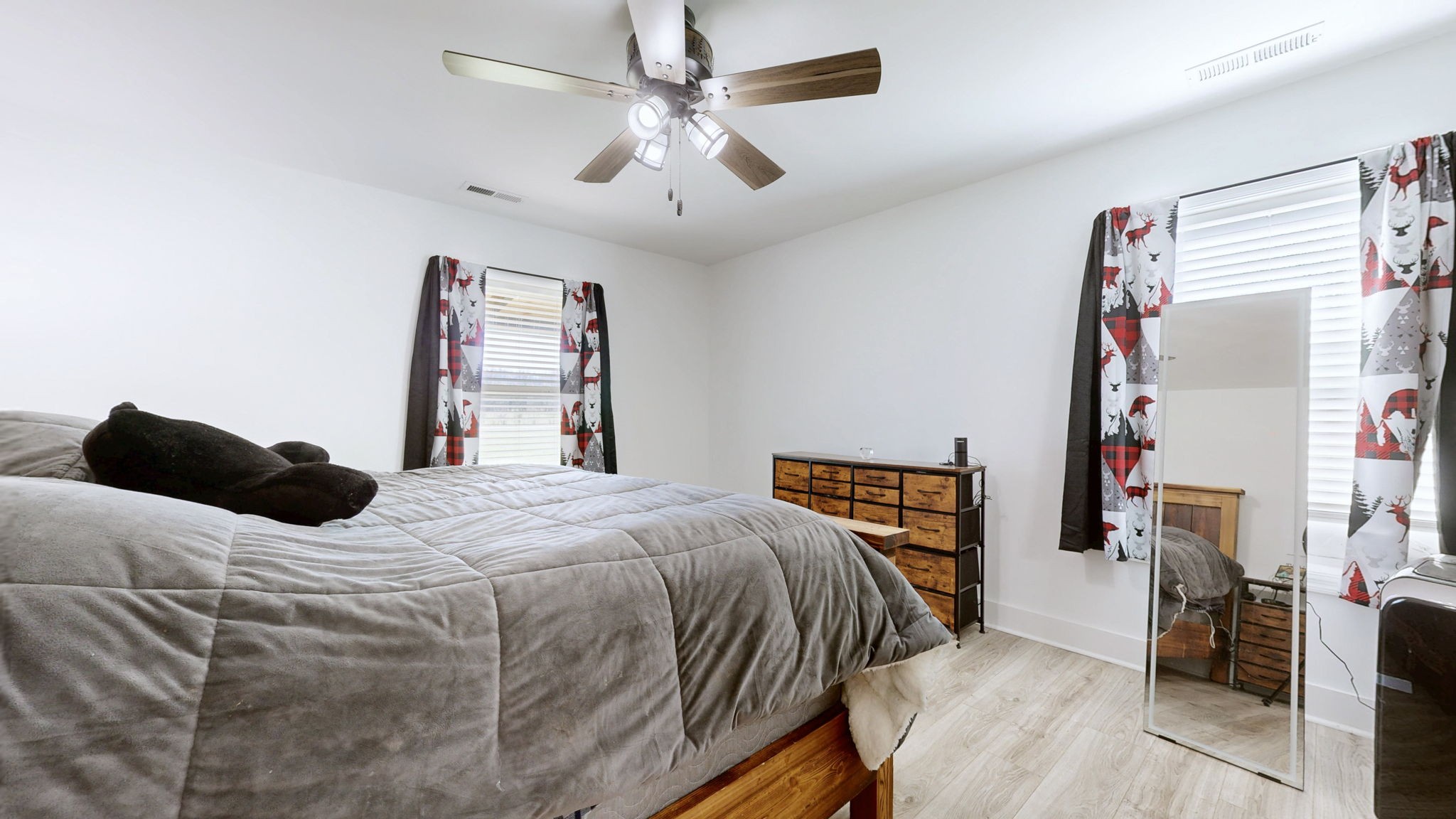2586 Brown Shop Road Petersburg, TN 37144 - Photo 35 of 57 a bedroom with a bed and a chandelier