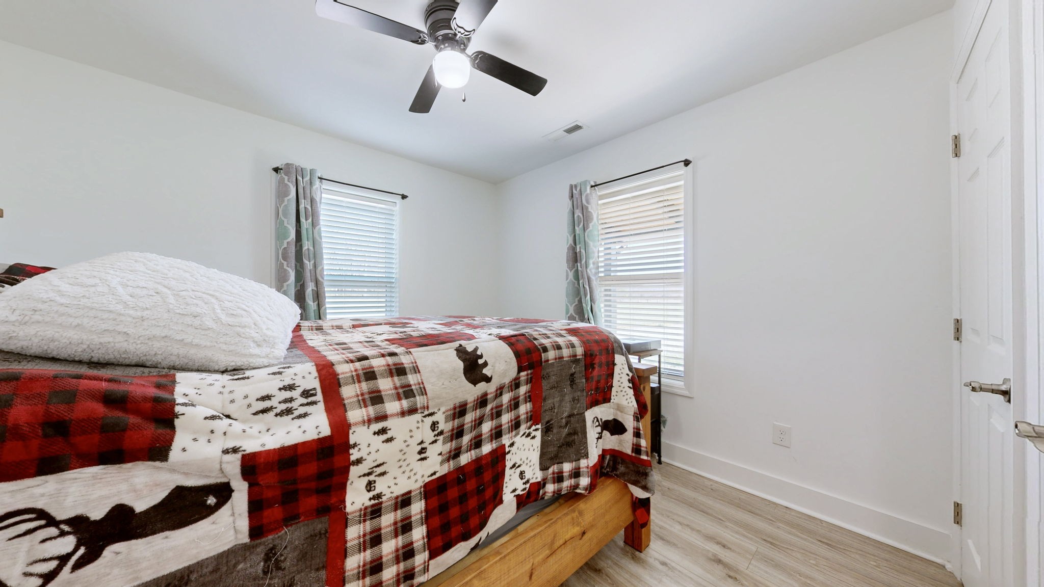 2586 Brown Shop Road Petersburg, TN 37144 - Photo 36 of 57 a bedroom with a bed next to a window with a chandelier