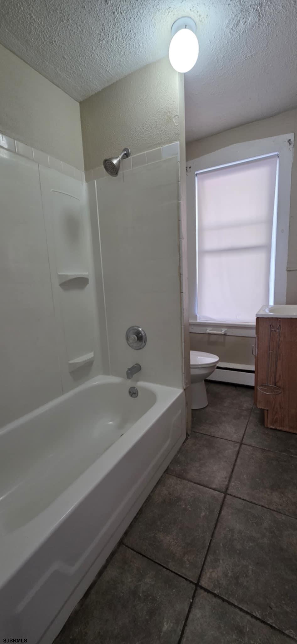 1419 Drexel Avenue, Unit 2 Atlantic City, NJ 08401 - Photo 7 of 9 a bathroom with a tub and a sink