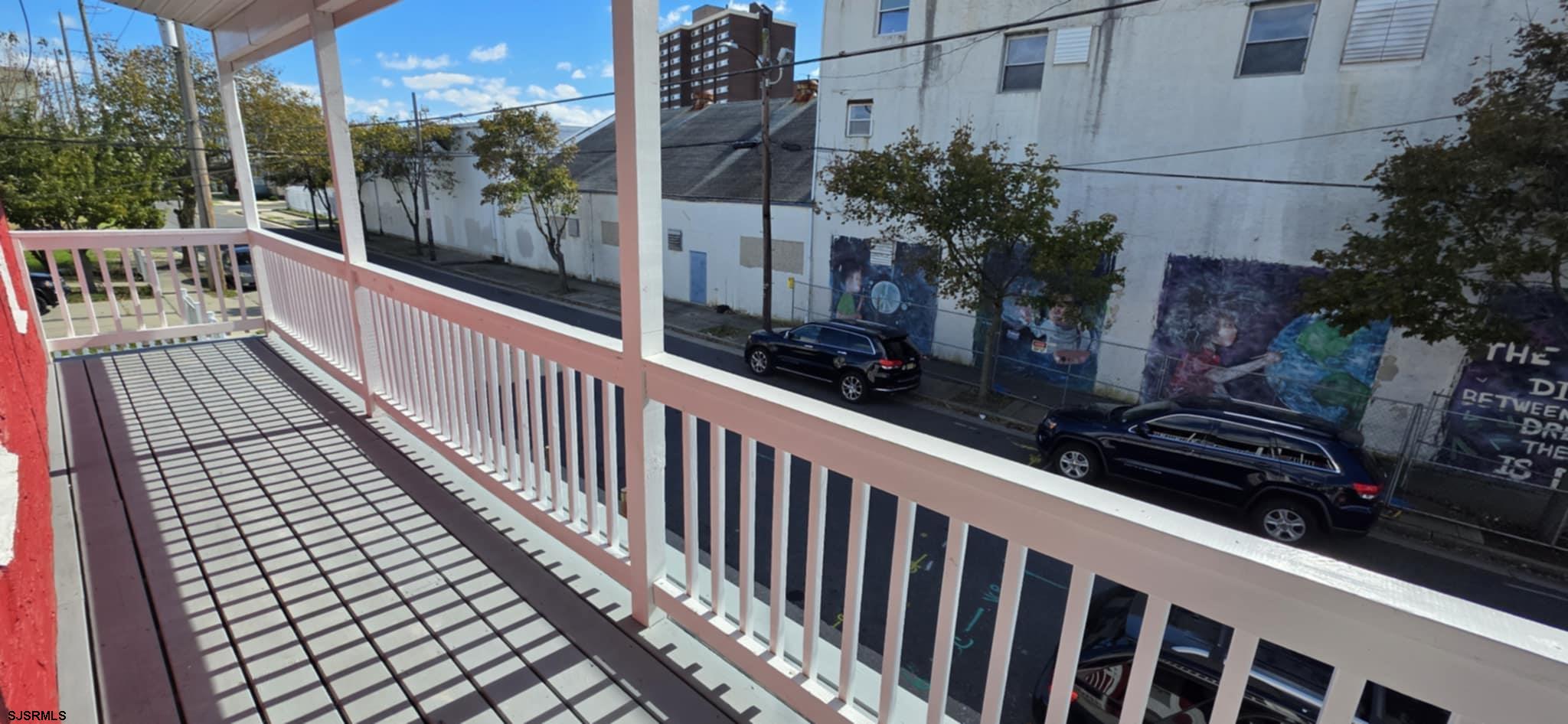 1419 Drexel Avenue, Unit 2 Atlantic City, NJ 08401 - Photo 9 of 9 a view of a balcony with wooden floor