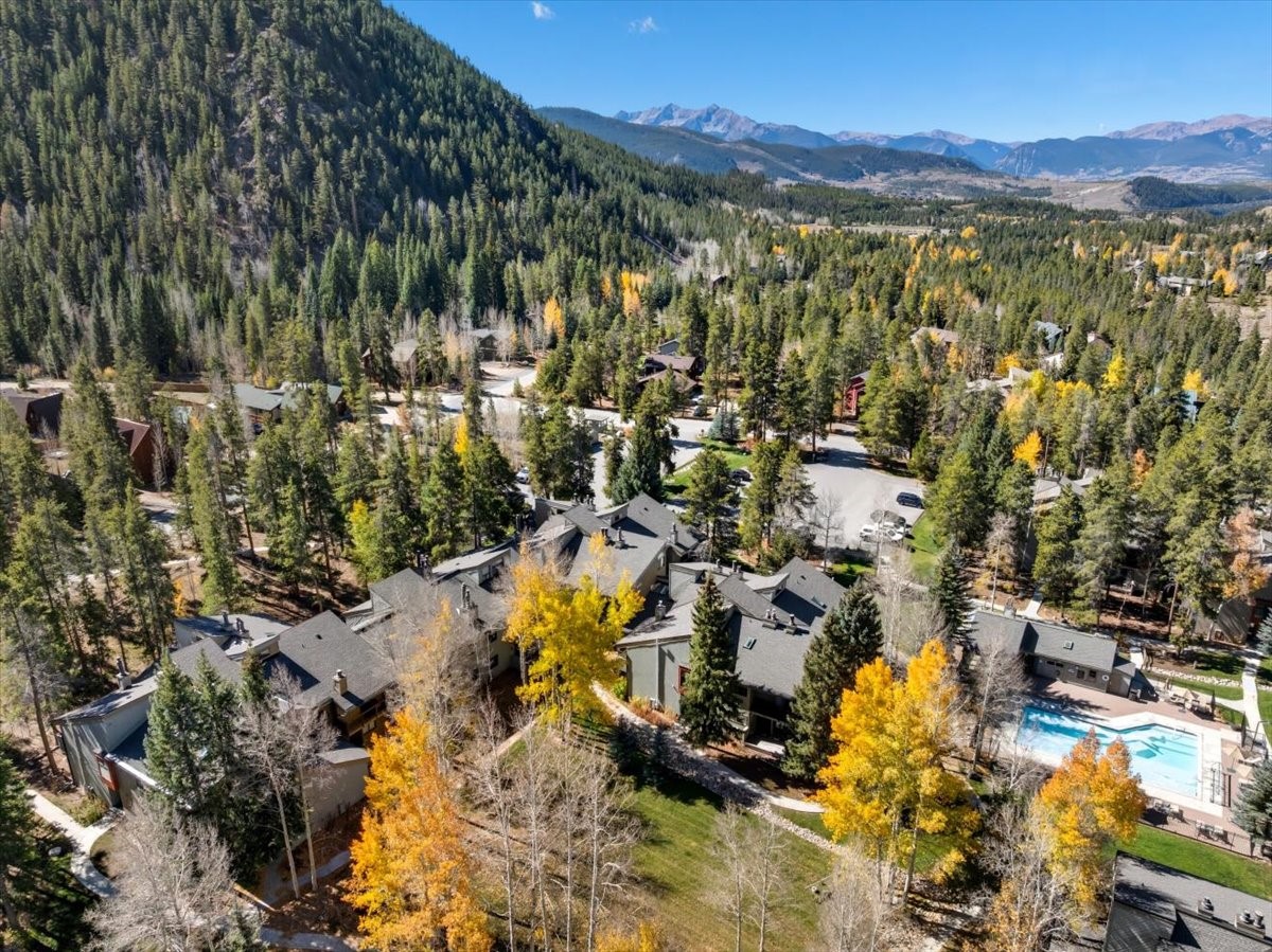 1937 Soda Ridge Road, Unit 1159 Keystone, CO 80435 - Photo 20 of 29 Aerial perspective of suburban area with a mountain backdrop and a forest