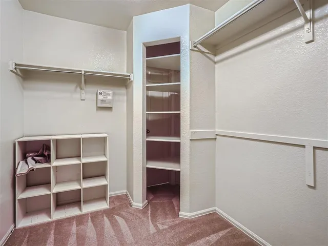 a view of an empty walk in closet