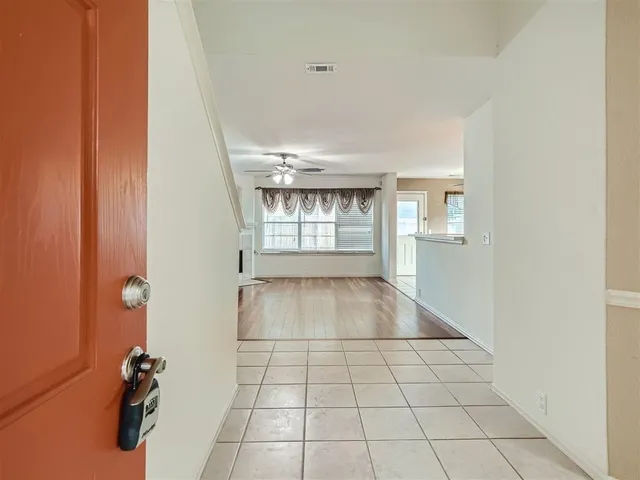 a view of an empty room and window